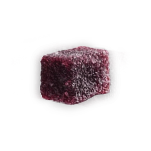 Red, sugar-coated, square jelly candy on a black background.