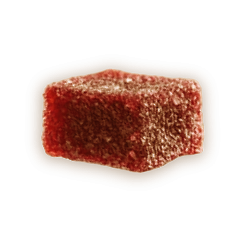 Red, sugar-coated, square jelly candy on a black background.